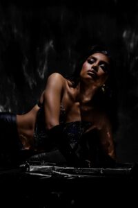 dramatic portrait of stylish woman in dark setting