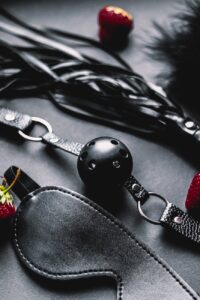 black ball gag and black blindfold